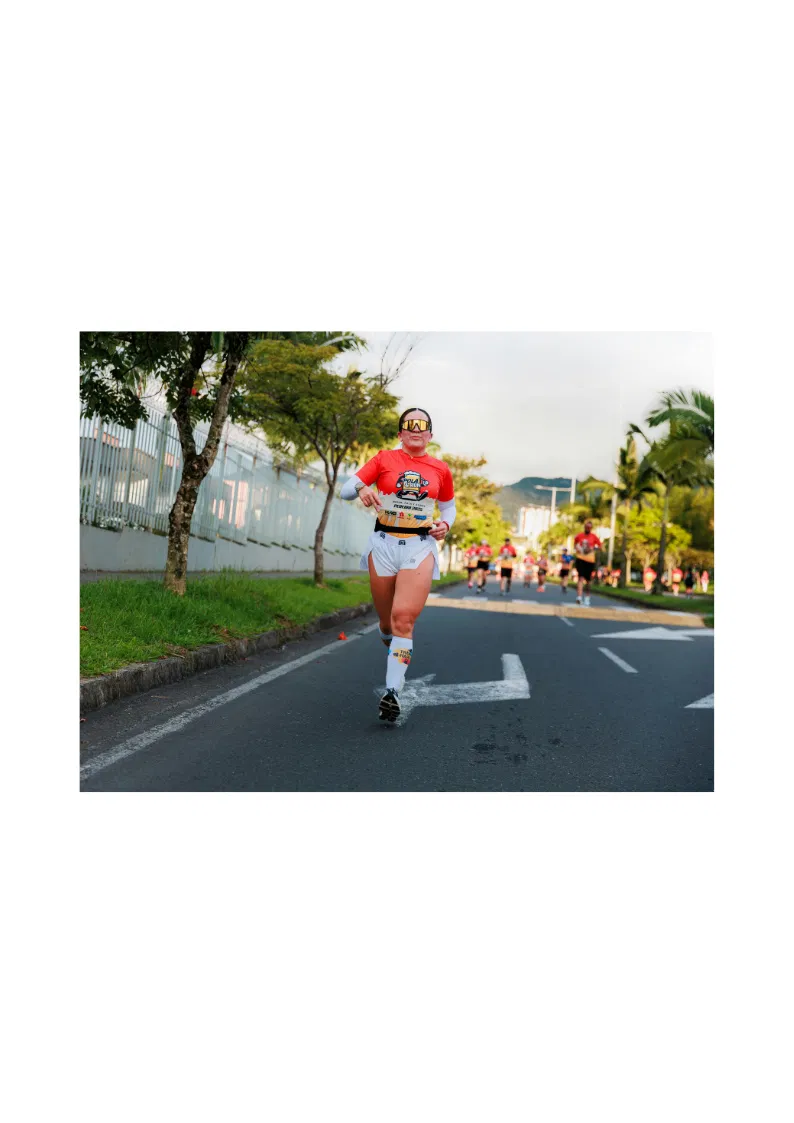Employee taking part in a company wellness running event